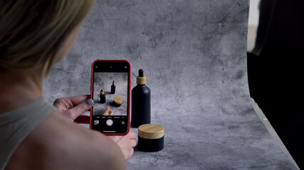 Woman make a photo of product for selling online in Internet from home