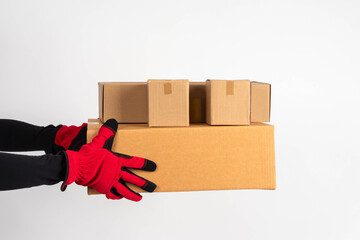Storage of goods in a warehouse. Warehouse storage. Cardboard boxes in the hands of the...