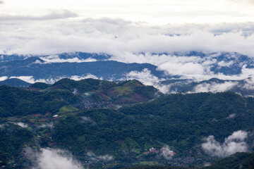 The scenery of the mountains and the sea of mist is the peak in Chiang Mai, northern Thailand, after the rain. filled with mist and green mountains