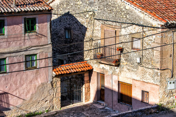 Fototapeta na wymiar building with stone facade and balcony