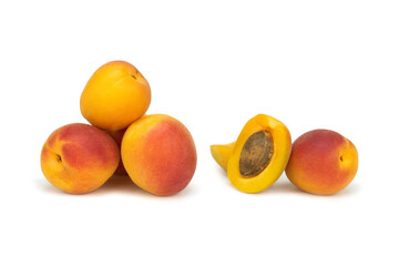 Whole and half fresh apricot on isolated white background