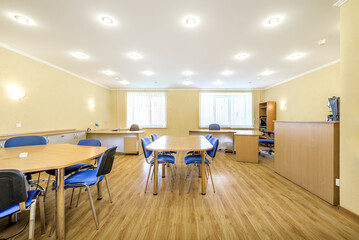 Modern furnished office with office desks and chairs