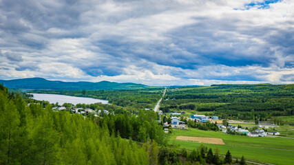 Fototapeta premium View on the countryside and the Notre Dame mountains (Monts Notre Dame) from the Monts Notre Dame scenic road in Bas Saint Laurent region of Quebec province (Canada)