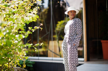 Beautiful african american woman natural makeup wear fashion clothes casual black and white dress...