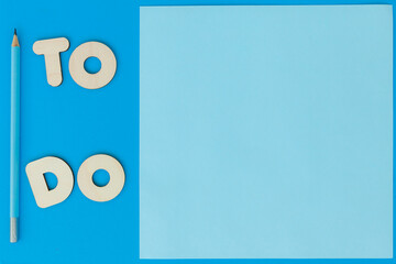 Blue sheet of paper and inscription TO DO, copyspace, top view