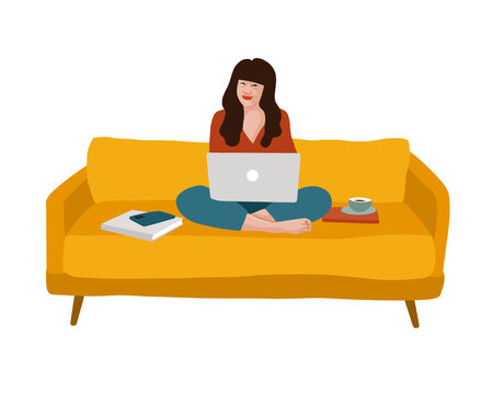 Person on a couch with a computer on their lap and books around them.