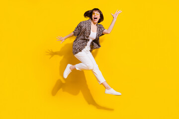 Fototapeta na wymiar Full length body size view of pretty amazed crazy cheerful girl jumping running isolated bright yellow color background