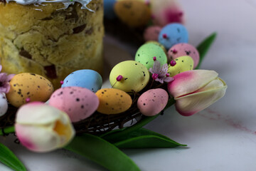 Easter wreath of decorative quail eggs and tulips. Top view of the rattan wreath. Easter decor
