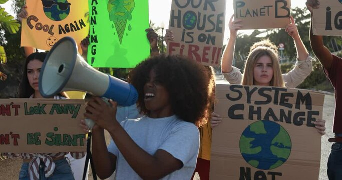 Young People From Different Cultures With Banner Fighting For Global Climate Change 