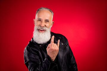 Photo of aged handsome man happy positive smile show rock sign music lover brutal isolated over red color background