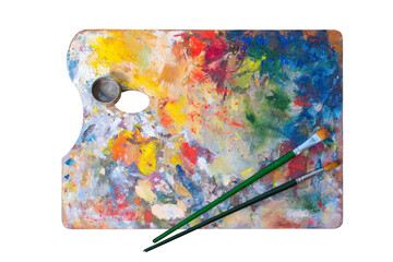 Artist's palette with brushes and mixed colors on a white background, isolate. Top view. Rectangular artist palette