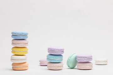 On a table with a white background, there are colorful model macaroons.

