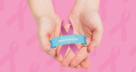 Composition of pink ribbon logo and breast cancer text above hands