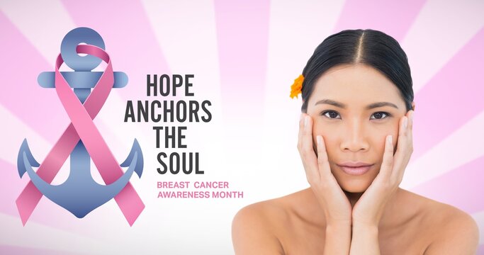 Composition of pink ribbon anchor logo and breast cancer text, with smiling young woman - Powered by Adobe