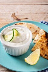 Traditional Greek Tzatziki on wooden table