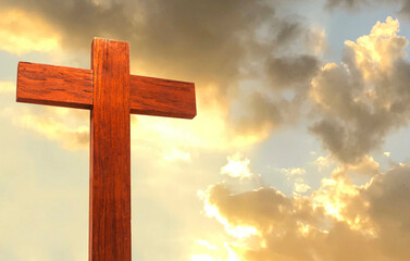 Wood Cross on a mountain top with beautiful sunset sky. Symbol of christianity