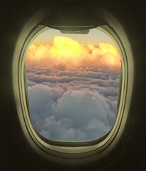 Looking out the plane windows. Beautiful scenic overhead airplane view of sunset colorful sky with fluffy clouds 