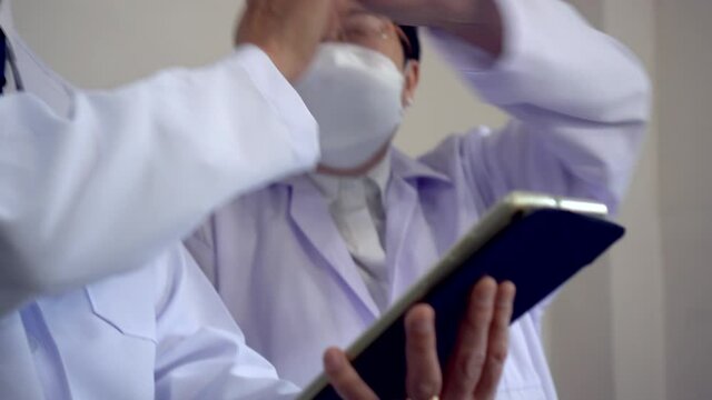 Two happy Asian scient researcher happy satisfy with medical solution information they have done positive emotion