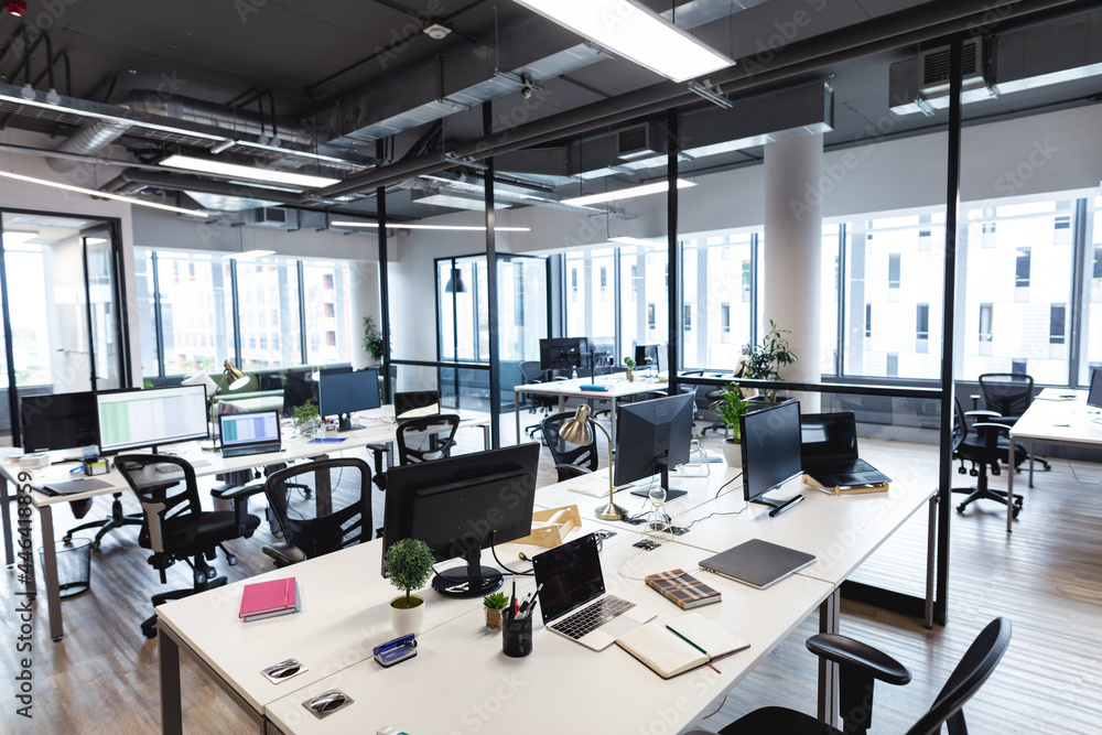 Wall mural interior of empty modern office with desks and computers