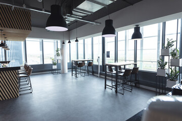 Interior of empty cafeteria with tables in modern office