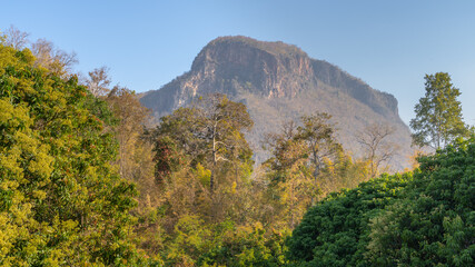 Tropical winter morning view of karst mountain with forest foreground near Chiang Dao, Chiang Mai, Thailand