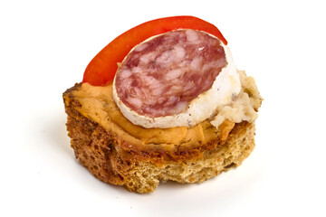 Bruschetta with fuet sausage, isolated on white background. High resolution image.