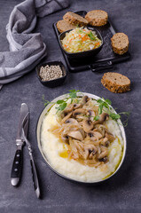 Mashed potatoes with butter, fried mushrooms with onions and salad of fresh vegetables