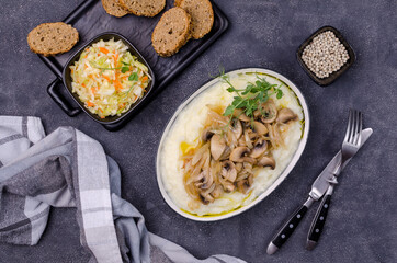 Mashed potatoes with butter, fried mushrooms with onions and salad of fresh vegetables