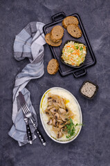 Mashed potatoes with butter, fried mushrooms with onions and salad of fresh vegetables