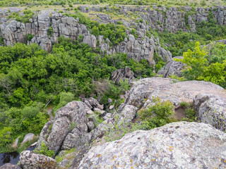 Fototapeta na wymiar Granite canyon on the Mertvovid river in Aktovo village, Nikolaev region, Ukraine. One of the natural wonders of Ukraine.