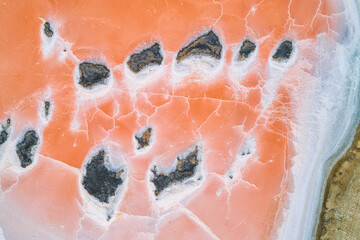 Pink lake in Kalmykia. Pink and white salt on a salt marsh. Incredible texture nature