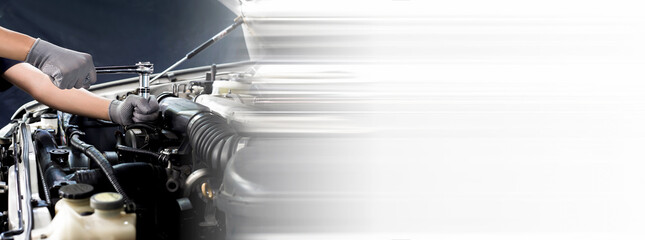 Car mechanic working on car engine, car maintenance concept.