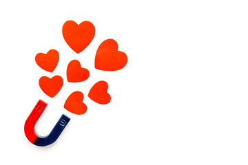 Dating love concept. Magnet with heart shapes, top view