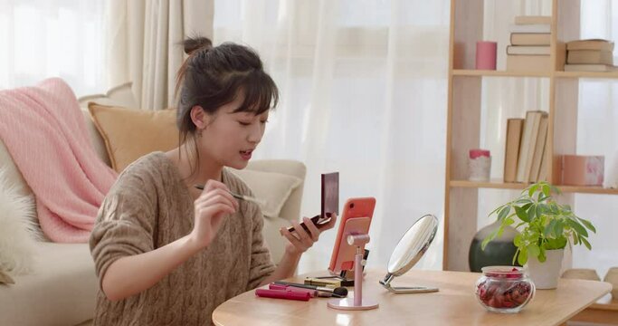 Young woman doing live webcast at home,4K