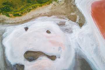 Pink lake in Kalmykia. Pink and white salt on a salt marsh. Incredible texture nature