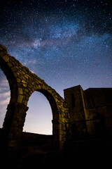 Milky way and Neowise comet in Santuari De La Mare De Deu Del Mont church, Spain