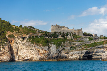 Ancient Doria Castle (1164-XIX century) of Porto Venere or Portovenere town, UNESCO world heritage site, on the rocky coastline along the Mediterranean Sea. La Spezia, Liguria, Italy, Europe.