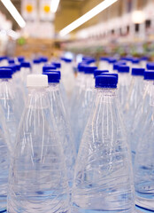 water bottles with blue caps in supermarket