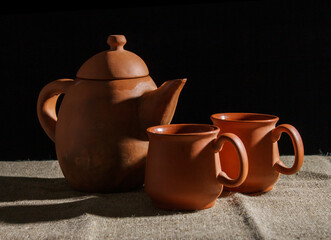 still life with a clay teapot and two cups