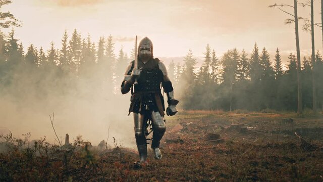 Lonesome Medieval Knight Marching Through Forest. Invaded, Colonizer, Crusader, Soldier, Warrior Wearing Body Armor, Helmet, Shield and Sword Traveling Through Mysterious Land Tracking Wide Front View