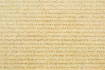 Cardboard surface with horizontal stripes as background, texture, pattern.