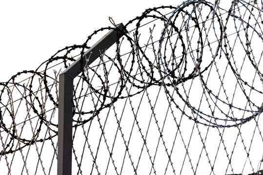 Aggressive type fence. Razor wire, types of barbed wire. Barbed wire fence.