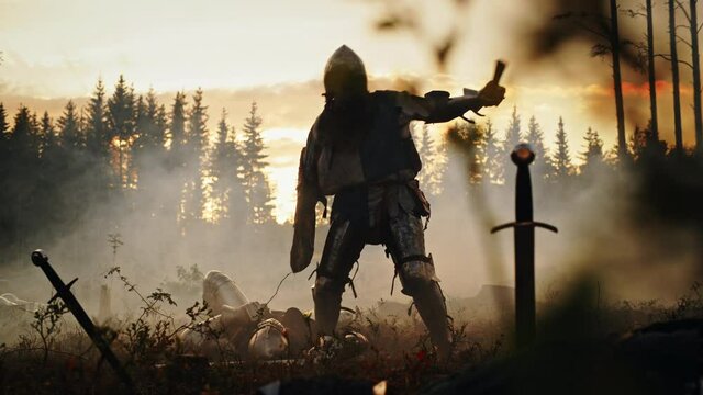 Dark Age Battlefield: Brutal Fight to Death of Two Armored Medieval Knights, Killing Enemy with Sword. Battle of Armed Warrior Soldiers. Dramatic Scene, Cinematic Smoke, Light in Historic Reenactment