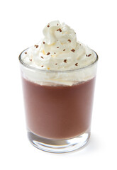 Milk chocolate pudding with whipped cream in a glass, isolated on a white background. Close-up.