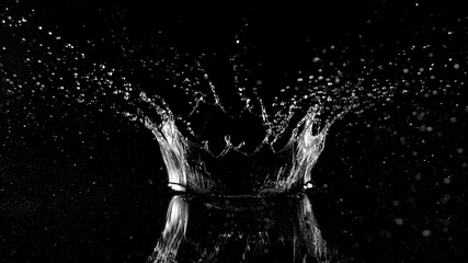 Freeze motion of water splash on black background.