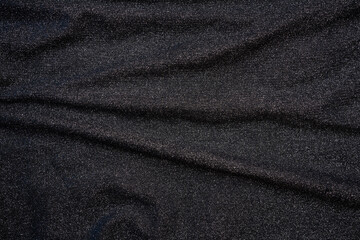 Glittering fashion black background with twinkling grainy texture