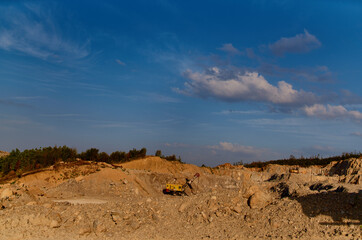 Fototapeta na wymiar excavator ground leveling construction site