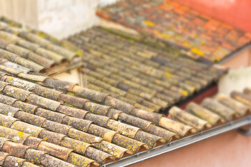 Old roof tiles on the roof of an old house as seamless pattern