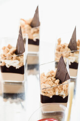 luxury wedding catering, table with modern desserts, cupcakes, sweets with fruit. High quality photo