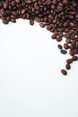 Fresh aromatic roasted coffee beans isolated on white background. Vertical